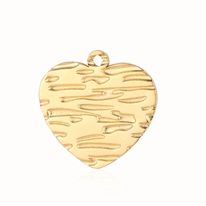 Detailed view of heart-shaped gold pendant with vintage bark texture on white background