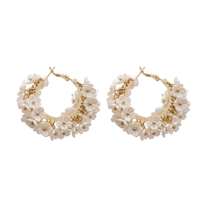 Elegant C-shaped hoop earrings featuring clustered white pearl flowers and gold metal finish