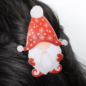 Christmas gnome hair claw clip with red hat and snowflake pattern on black hair