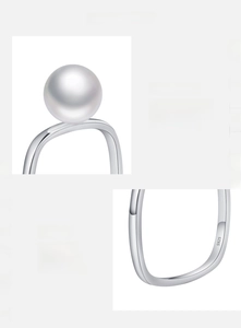 Macro shot of S925 sterling silver stamp and high-luster pearl detail on an elegant ring