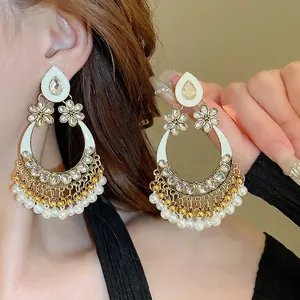 Ethnic hollow teardrop earrings with white enamel, crystal flowers and pearl tassels
