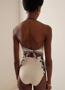Detail of cross back tie design on navy cream bikini with vintage pattern texture