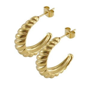 Detail view of 18K gold plated stainless steel C-hoop earrings with ribbed texture
