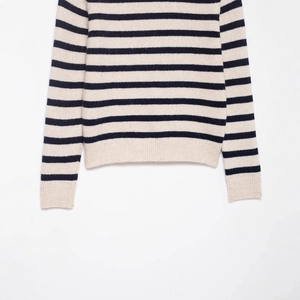 Classic striped crewneck knit sweater in beige and navy blue with ribbed hem and cuffs