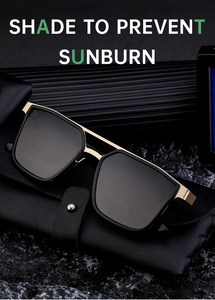 Close-up of black and gold square frame sunglasses on a leather case with rock texture