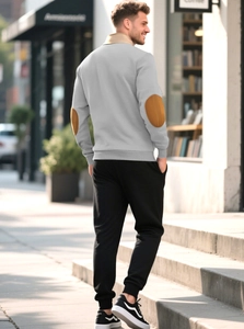 Detailed back view of men's grey sweatshirt featuring brown suede elbow patches