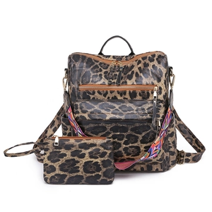Detail of leopard print backpack set with colorful woven strap and golden hardware