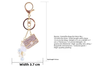 Detailed dimensions of camellia bag keychain with purple rhinestones and pearls