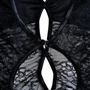 Detail of black lace dress showing the hollow back design and metal clasp fastener
