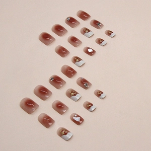 Short blush French press-on nails with glitter diamonds and eggshell fragments