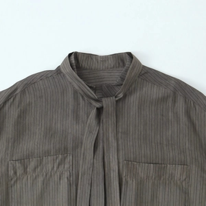 Taupe striped long sleeve blouse with stand collar bow and delicate pocket detail