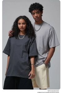 Close-up of lifestyle styling featuring heavyweight cotton oversized t-shirts with chains