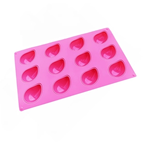Pink silicone mold with twelve teardrop shaped cavities for mousse and chocolate