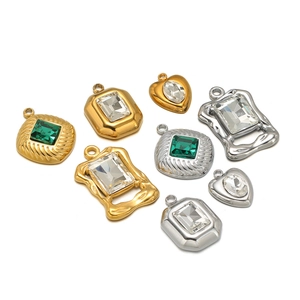 Set of gold and silver stainless steel pendants with emerald and clear crystal stones
