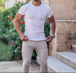 Outdoor shot of men's white vertical striped slim fit T-shirt with a casual crew neck