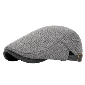 Grey knitted beret hat for men and women featuring textured fabric and a metal buckle