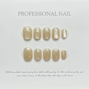 Short round champagne cat eye press-on nails set with vibrant rainbow laser shimmer