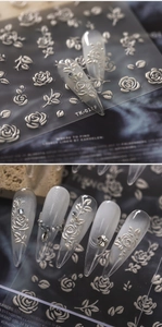 Macro view of 3D embossed rose flower nail stickers with textured white pearl finish TK-018F