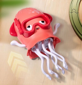 Detail of a pink cartoon dancing octopus toy with diving mask on a wooden floor