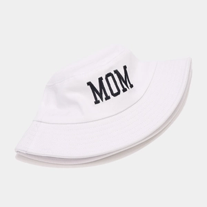 Close-up of black MOM embroidery on white canvas bucket hat with detailed stitching