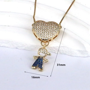 Detail showing boy figure with heart pendant dimensions measuring 31mm by 16mm