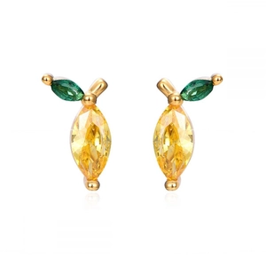 Macro detail of lemon-shaped stud earrings with yellow crystals and green leaf stones