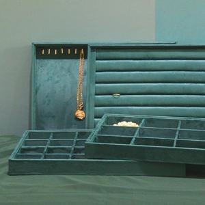 Dark green velvet jewelry display tray set with slots for rings and necklace hooks