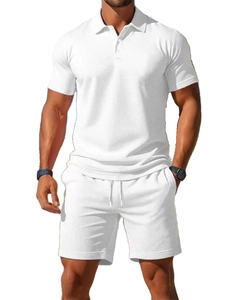 Detailed view of men's white short-sleeved polo shirt and shorts set in breathable knit fabric