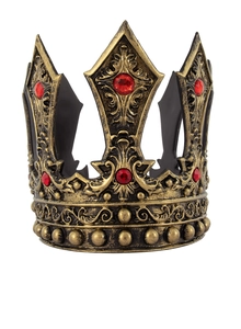 Detailed view of vintage gold crown with red gems and ornate medieval relief patterns