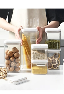 Close-up of airtight food grade containers with stacked dry grains in a modern kitchen