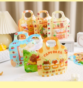 Detail of Christmas zipper bags featuring cute Capybara patterns and portable handles