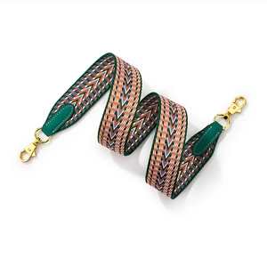 Green and orange geometric woven wide shoulder strap with golden metal clasps
