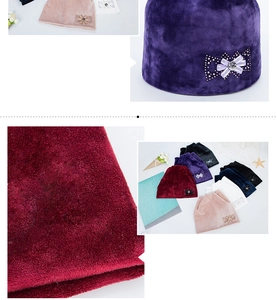 Close-up of velvet cat ear hat fabric texture with sparkly rhinestone bow detail