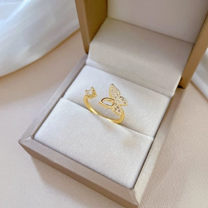 Adjustable hollow butterfly ring in gold finish with sparkling pavé zircon stones