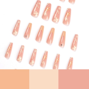 French tip floral press-on nails with rhinestones in long coffin shape and nude pink tones