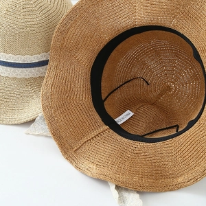 Japanese style wide brim straw hats with lace lace and adjustable inner strap detail