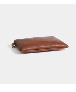 Detailed side view of a brown litchi-textured PU leather pouch with a small metal ring