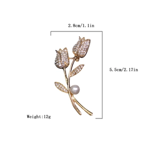 Detailed view of double floral gold brooch with pearls and crystals showing size dimensions