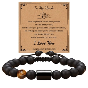 Men's matte black beads and tiger eye stone bracelet with brown gift message card