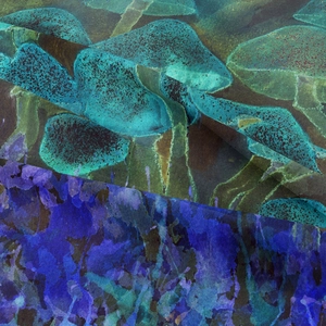 Detail of bohemian mushroom tapestry fabric with green and purple botanical prints