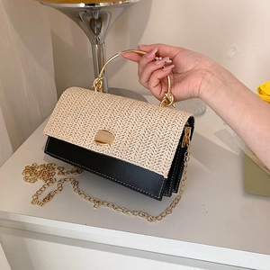 Retro woven straw and black leather handbag with round gold handle and chain strap