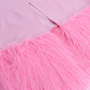 Close-up of pink party dress featuring plush faux fur trim and premium fabric stitching