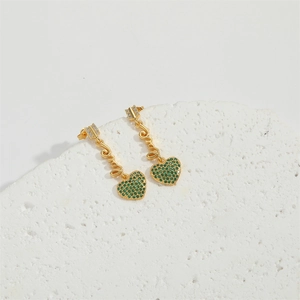 Elegant gold drop earrings featuring emerald heart charms and cubic zirconia accents