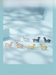 Detailed view of s925 silver dachshund stud earrings in four metallic color options