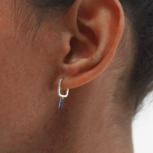 Close-up of S925 sterling silver U-shaped earrings with a blue rectangle gemstone drop