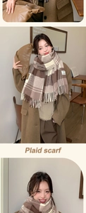 Detail of coffee plaid scarf with soft tassels and square FASHION fabric label
