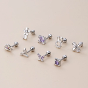 Detailed set of silver piercing studs featuring purple zircon butterfly and flower designs