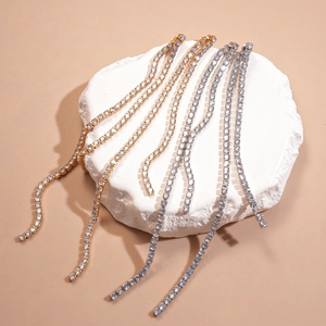 Elegant long tennis chain tassel earrings in gold and silver finish with zircons