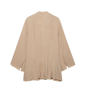 Detail view of the pleated beige chiffon dress back showing waist tie and soft texture