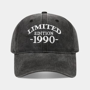 Detailed view of white embroidery on a vintage charcoal washed cotton baseball cap